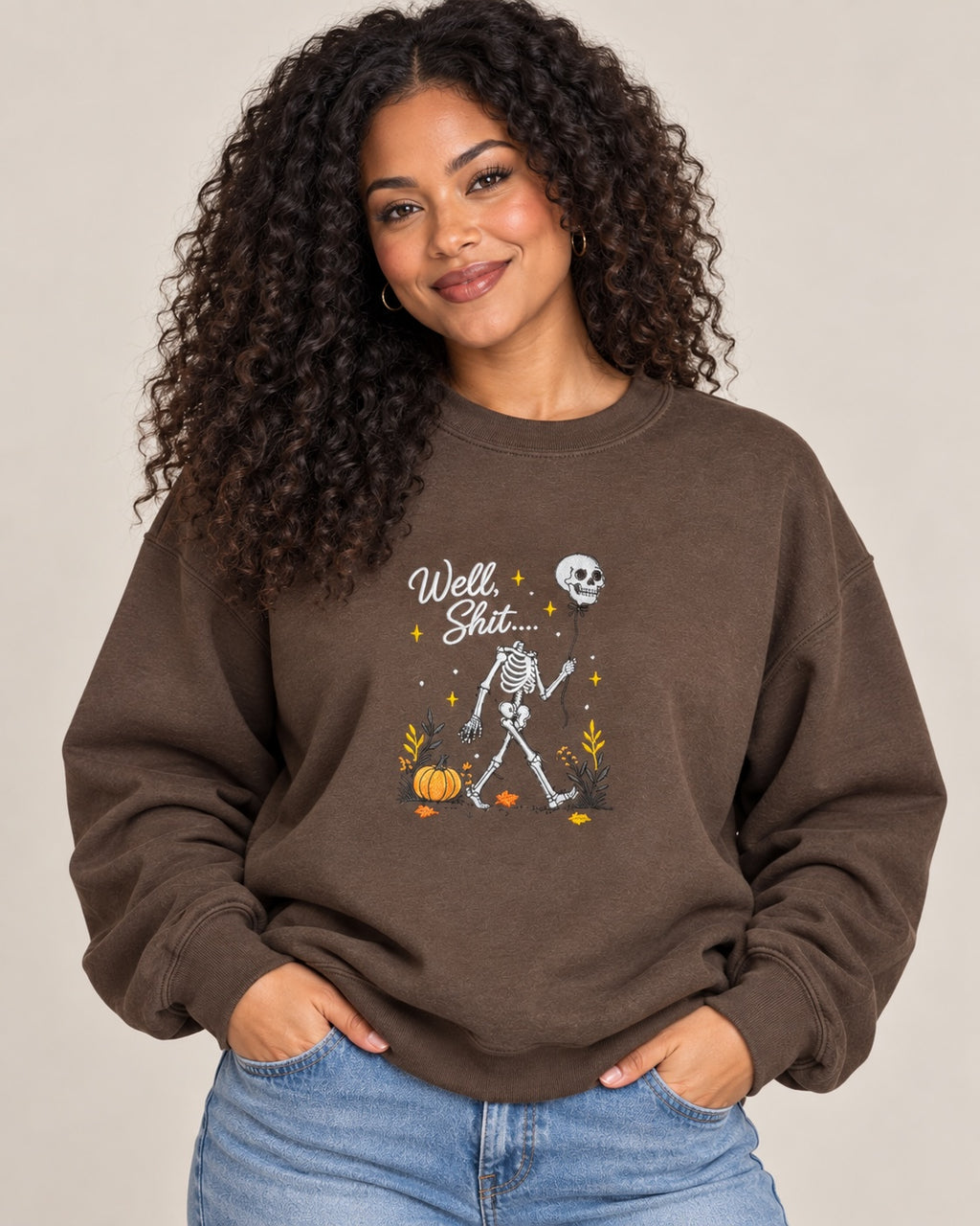 Untapped Innovations chocolate brown crewneck sweatshirt featuring a skeleton graphic with a balloon and pumpkins.