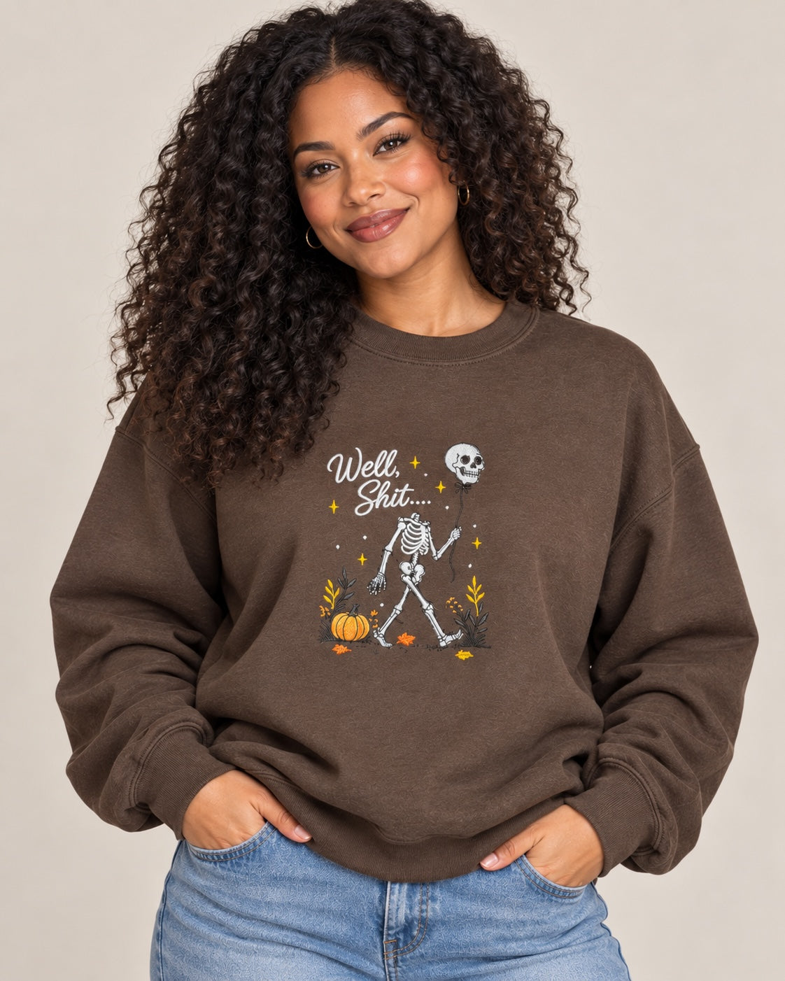 Untapped Innovations chocolate brown crewneck sweatshirt featuring a skeleton graphic with a balloon and pumpkins.