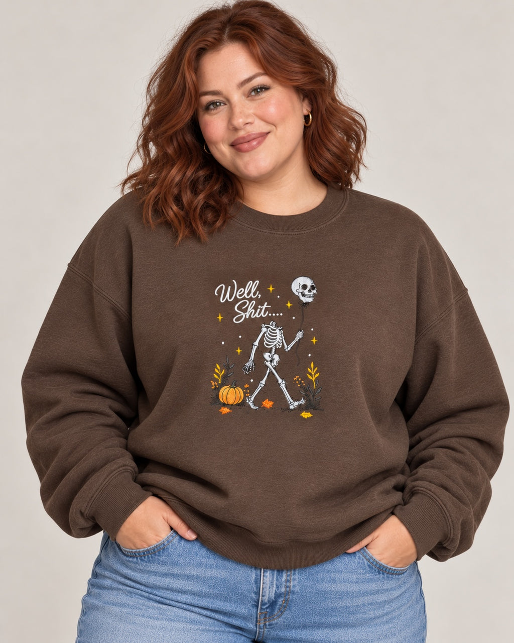 Untapped Innovations chocolate brown crewneck sweatshirt featuring a skeleton graphic with a balloon and pumpkins.