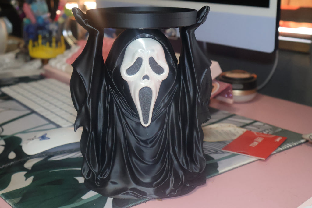 Untapped Innovations horror-themed ghost figure candle holder with a black robe and iconic white mask design.