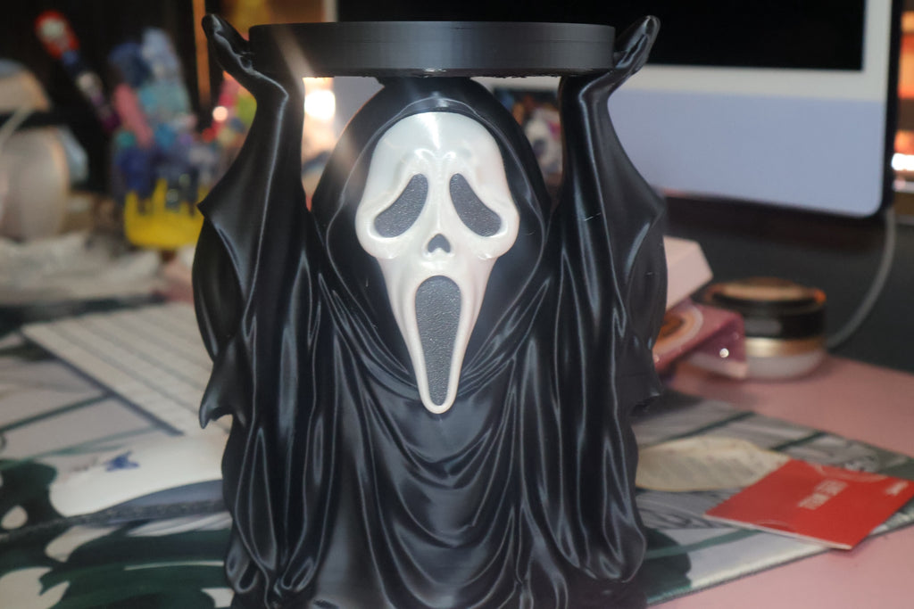 Untapped Innovations horror-themed ghost figure candle holder with a black robe and white mask for three-wick candles.