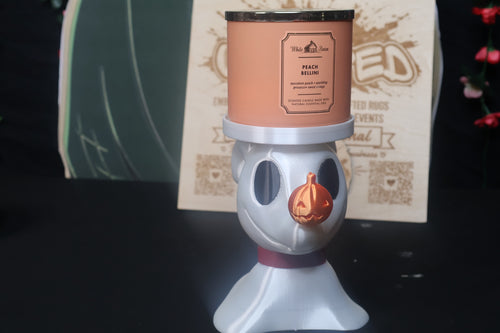 Untapped Innovations ghost dog candle holder with a pearlescent white finish and a glossy orange pumpkin nose.