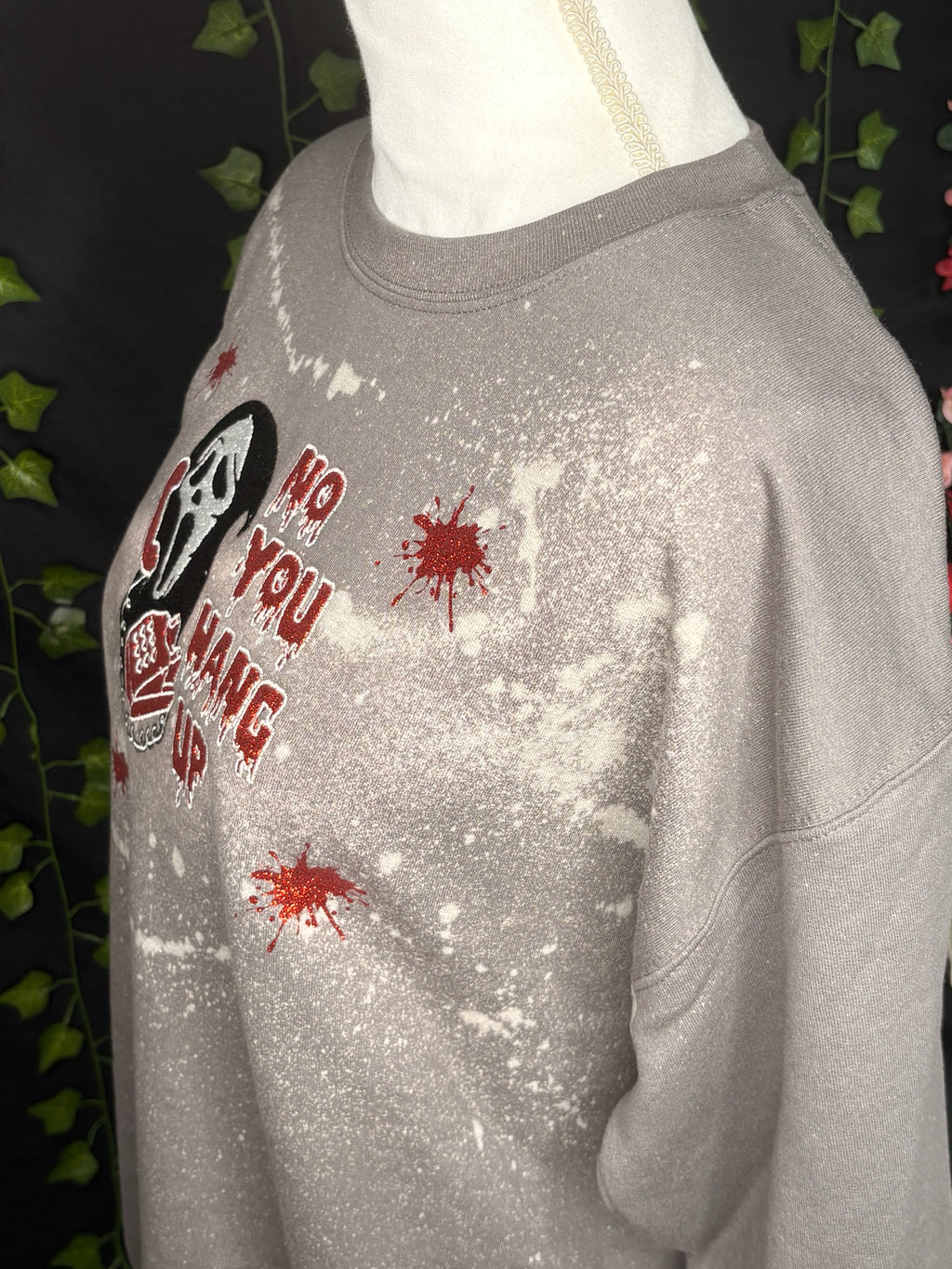 Untapped Innovations horror movie crewneck with bleached grey fabric, glittery red text, and blood splatter graphic.