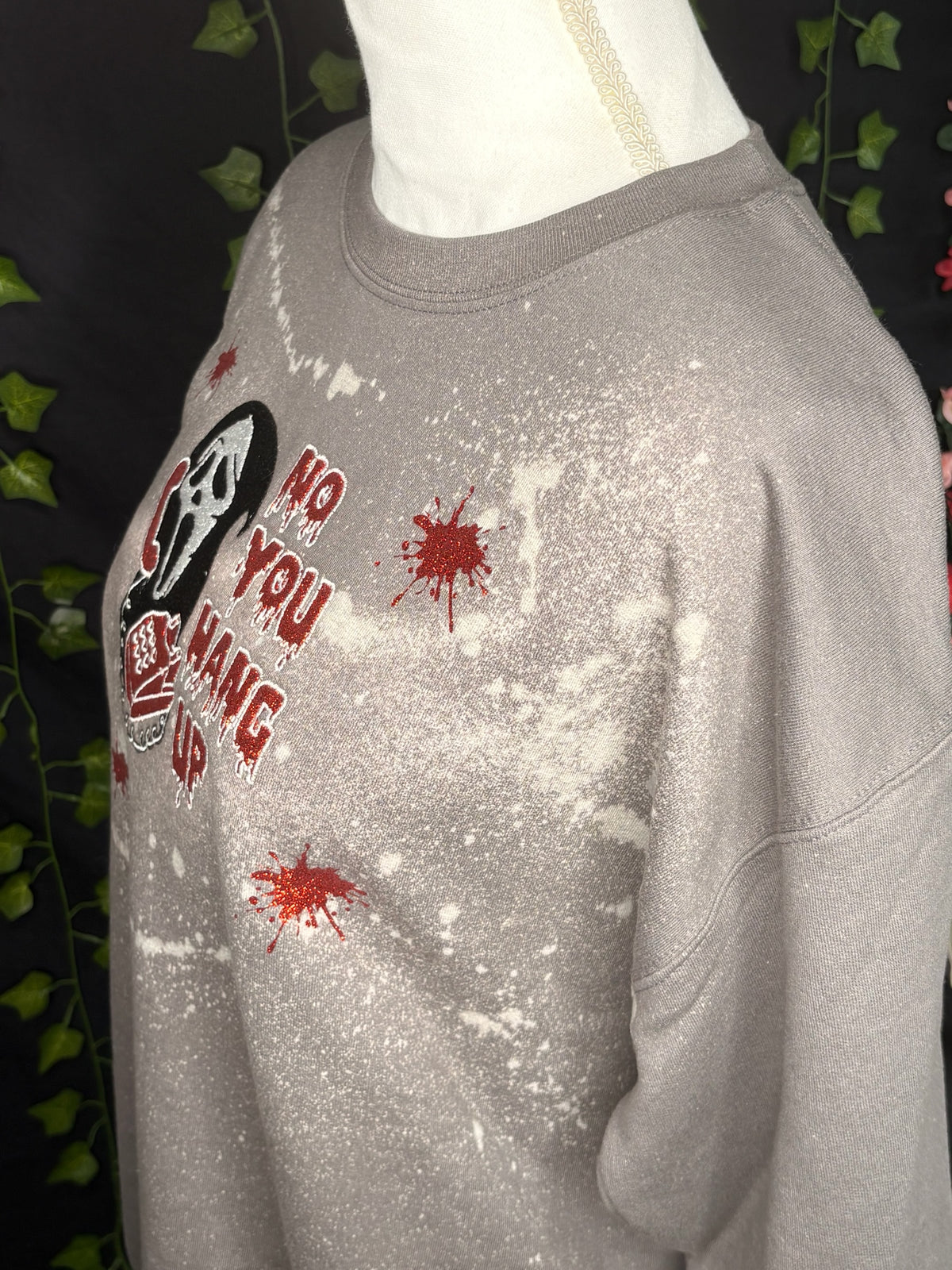 Untapped Innovations horror movie crewneck with bleached grey fabric, glittery red text, and blood splatter graphic.