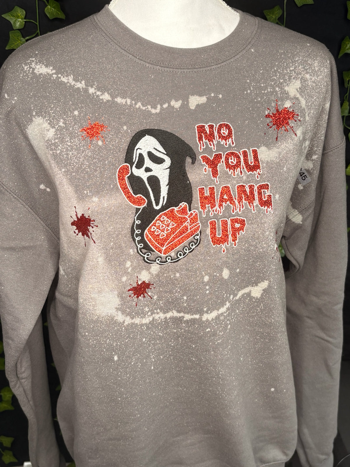 Untapped Innovations grey bleached crewneck sweatshirt with horror movie graphic, red glitter text, and blood splatters