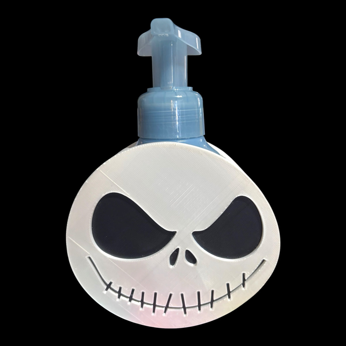 Untapped Innovations 3D-printed white Jack Skellington soap dispenser holder with a light blue foaming soap bottle.