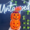 Untapped Innovations 3D-printed orange pumpkin stack beverage can cooler with jack-o'-lantern faces