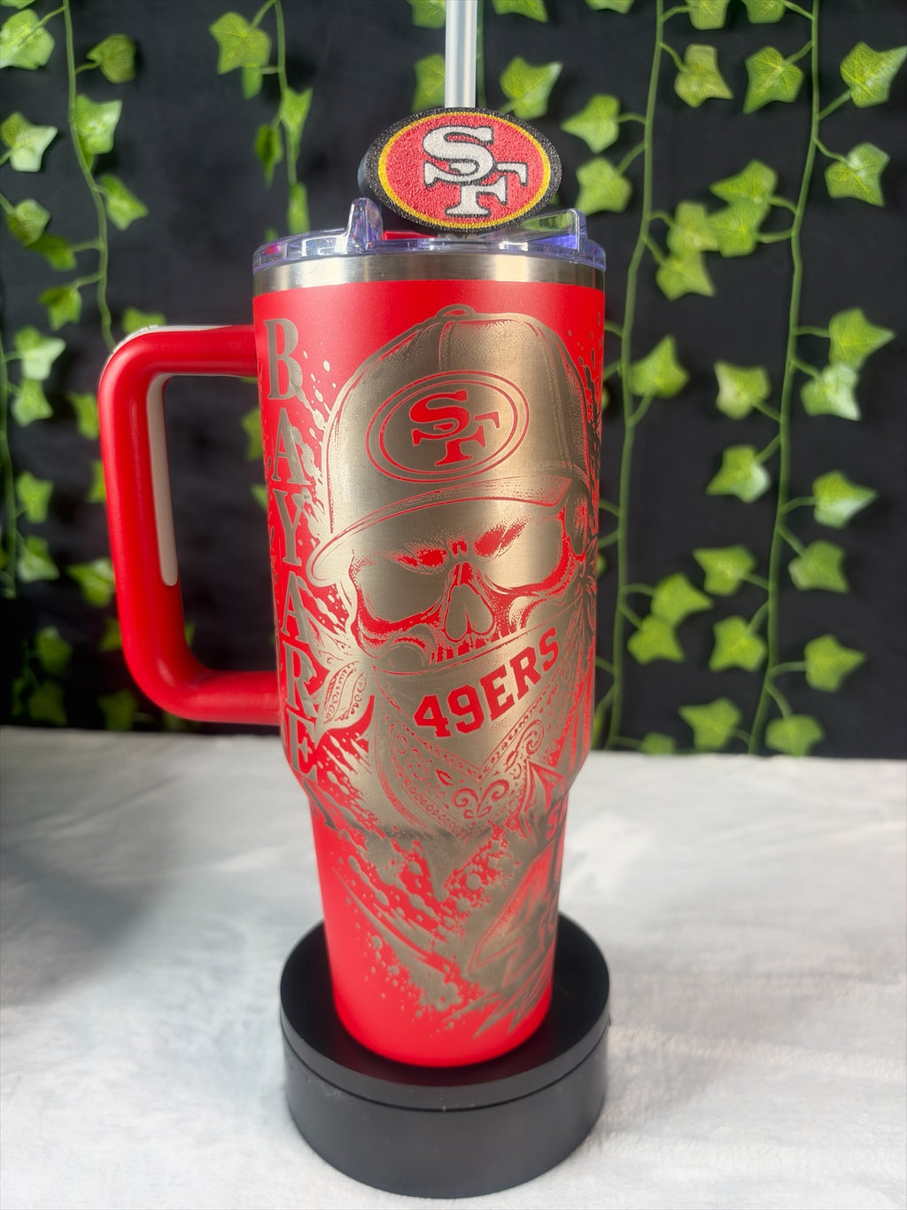 Untapped Innovations red 40oz stainless steel tumbler with laser-etched skull and San Francisco 49ers team branding.