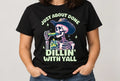 Untapped Innovations black crewneck t-shirt featuring a skeleton cowboy eating a pickle with the text Dillin With Yall