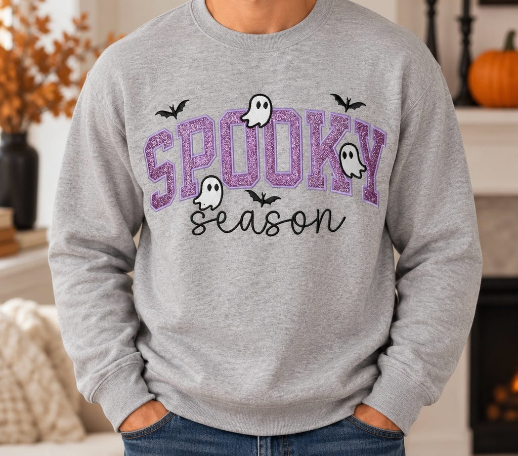 Untapped Innovations heather grey crewneck sweatshirt with purple glitter Spooky Season graphic, ghosts, and bats.