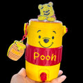 Untapped Innovations Winnie the Pooh beverage dispenser with yellow and red design, 3D character topper, and honey pot